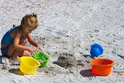Four year girl playing at Madeira Beach in Pinellas County, Florida, USA.