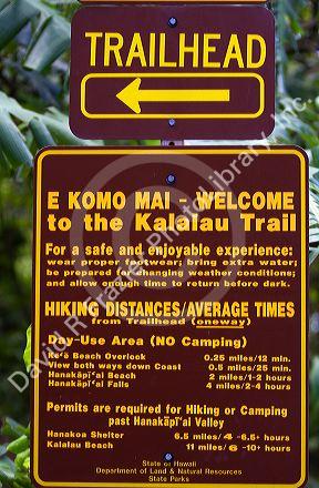 Kalalau trailhead sign marking a trail along the Na Pali Coast on the island of Kauai, Hawaii, USA.