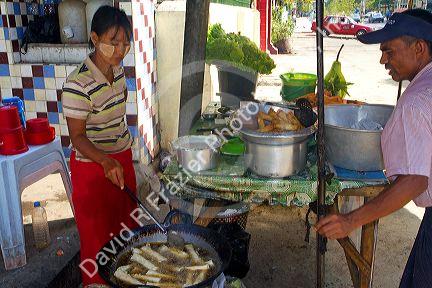 Street food vendor selling eggrolls in (Rangoon) Yangon, (Burma) Myanmar.