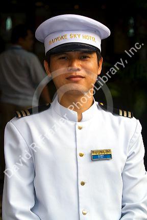 Doorman of the Baiyoke Sky Hotel located in the Baiyoke Tower II in the Ratchathewi district of Bangkok, Thailand.