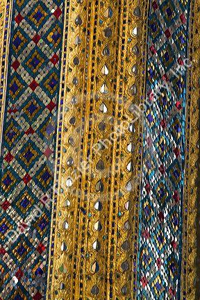 Building detail at the Temple of the Emerald Buddha located within the precincts of the Grand Palace, Bangkok, Thailand.