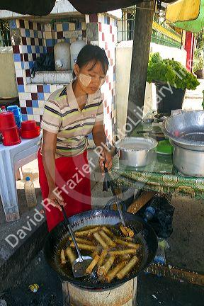 Street food vendor selling eggrolls in (Rangoon) Yangon, (Burma) Myanmar.