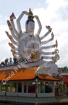 18 arm Buddha statue at Wat Plai Laem temple located on the island of Ko Samui, Thailand.