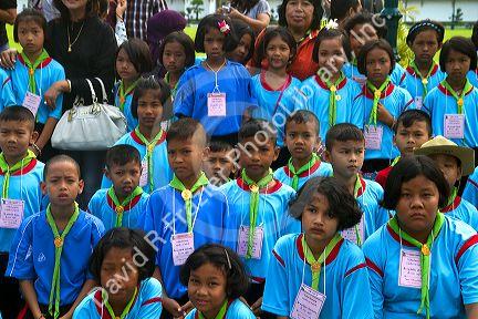 Thai school students wearing uniforms visit The Grand Palace in Bangkok, Thailand.