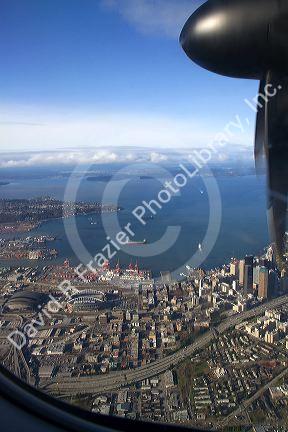 View from an airplane window of Elliott Bay and Seattle, Washington, USA.