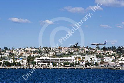 An airplane lands in San Diego, California.