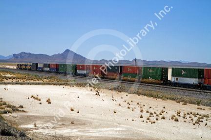 Union Pacific Railroad locomotive traveling along Interstate 10 through southwest New Mexico, USA.