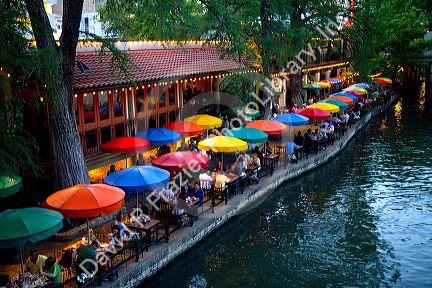 Colorful umbrellas at the Casa Rio restaurant along the River Walk in San Antonio, Texas, USA.