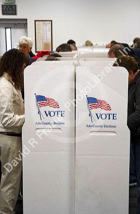 People vote in cardboard voting booths at a polling station in Boise, Idaho, USA.