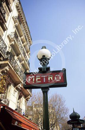 A Paris Metro sign and lamp post, France.