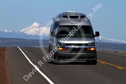 Automobile traveling on U.S. Route 20 east of Bend, Oregon, USA.