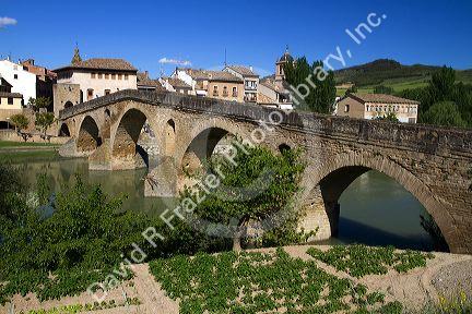 Six-arched Roman bridge spanning the Arga River on the Way of St. James pilgrimage route in Puente La Reina, Navarra, Spain.