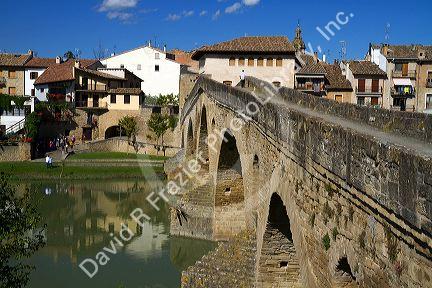 Six-arched Roman bridge spanning the Arga River on the Way of St. James pilgrimage route in Puente La Reina, Navarra, Spain.
