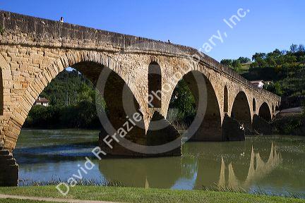 Six-arched Roman bridge spanning the Arga River on the Way of St. James pilgrimage route in Puente La Reina, Navarra, Spain.