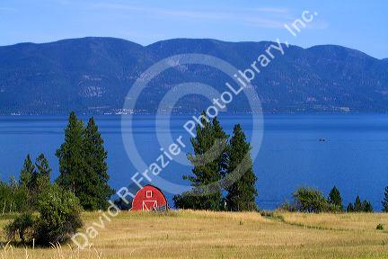 Red barn and farmland along Flathead Lake, Montana, USA.