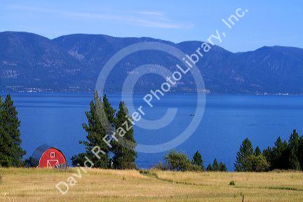 Red barn and farmland along Flathead Lake, Montana, USA.