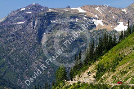 Red Jammer bus on the Going-to-the-Sun Road in Glacier National Park, Montana, USA.