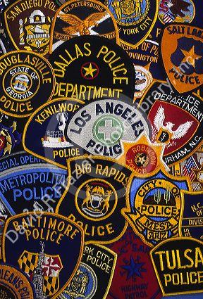 A collage of United States police officer shoulder patches.