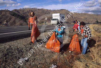 Adopt A Highway volunteers pick up litter.
