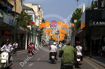Motor scooters on Trang Tien street in Hanoi, Vietnam.