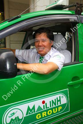 Mai Linh taxi and driver in Ho Chi Minh City, Vietnam.