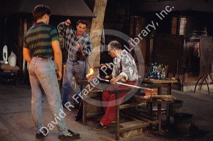 Workers at a glass blowing shop in Algaida, Majorca, Spain.