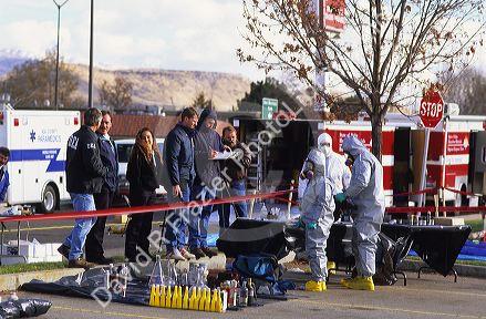 Drug enforcement and hazardous materials agents raid a drug lab.