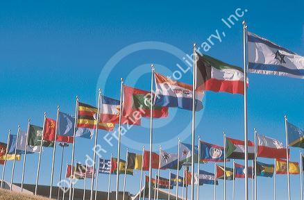 Flags of many nations flying on flag poles at church in Lansing, Michigan.