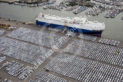 Automobiles being unloaded from a ship at the Port of Long Beach in Los Angeles, California.