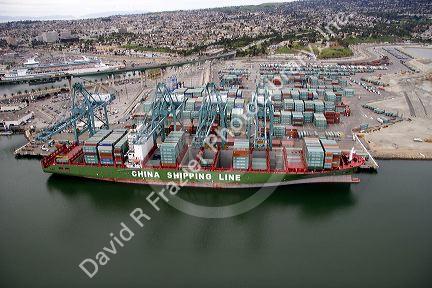 Containers being unloaded from a ship at the Port of Long Beach in Los Angeles, California.