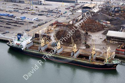 Scrap metal being loaded to a ship for export at the Port of Long Beach in Los Angeles, California.