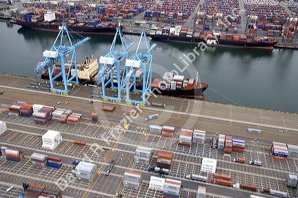 Containers being unloaded from a ship at the Port of Long Beach in Los Angeles, California.