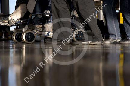 Feet walking at an airport.