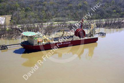 Ship designed to lay cable underwater berthed near New Orleans, Louisiana on the Mississippi River.