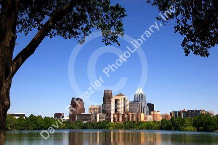Cityscape skyline view of Austin, Texas with City Lake in the foreground.