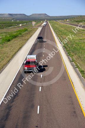 Truck with a u-haul trailer traveling on Interstate 10 east of Ft. Stockton, Texas.