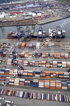 Containers being unloaded from a ship at the Port of Long Beach in Los Angeles, California.
