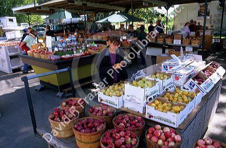 Customers shop at a fruit and vegetable stand in Marsing, Idaho.