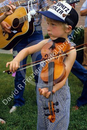 A young fiddle player at the Fiddle Festival in Weiser, Idaho.