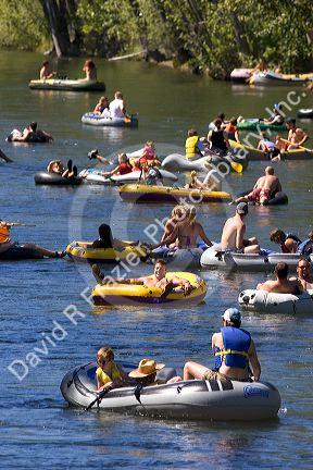People float the Boise River on rafts and tubes. Boise, Idaho.