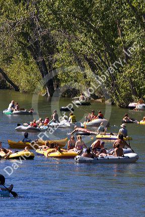People float the Boise River on rafts and tubes. Boise, Idaho.