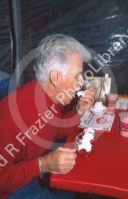 Senior citizen eating strawberry shortcake at Parkdale Farms in Plant City, Florida.