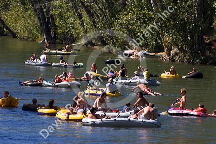 People float the Boise River on rafts and tubes. Boise, Idaho.