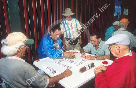 Men playing dominos at Gomez Park in Little Havana, Miami, Florida.