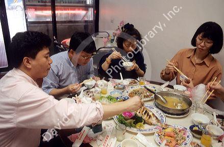 Chinese people eating a meal in a restaurant, Taiwan.