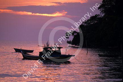Boats at sunset in Melaka, Malaysia.