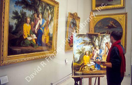 Art student copies painting at the Lourve in Paris