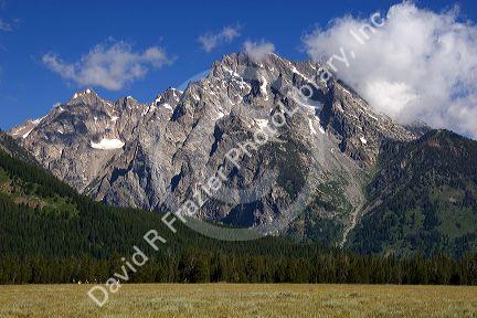 Horseback riding in Grand Teton National Park, Wyoming beneath Mt. Moran.