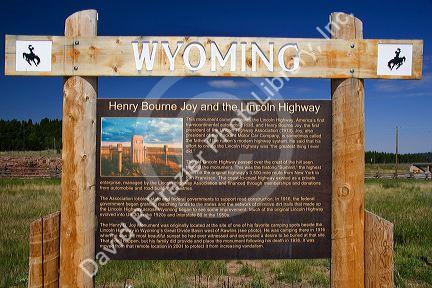 The Lincoln Highway Memorial along I-80 in Wyoming. Sign reads that it is the first cross country paved road in the United States of America.