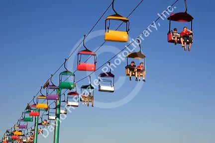 People ride the gondola at the Iowa state fair in Des Moines.